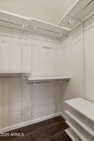 a view of an empty walk in closet
