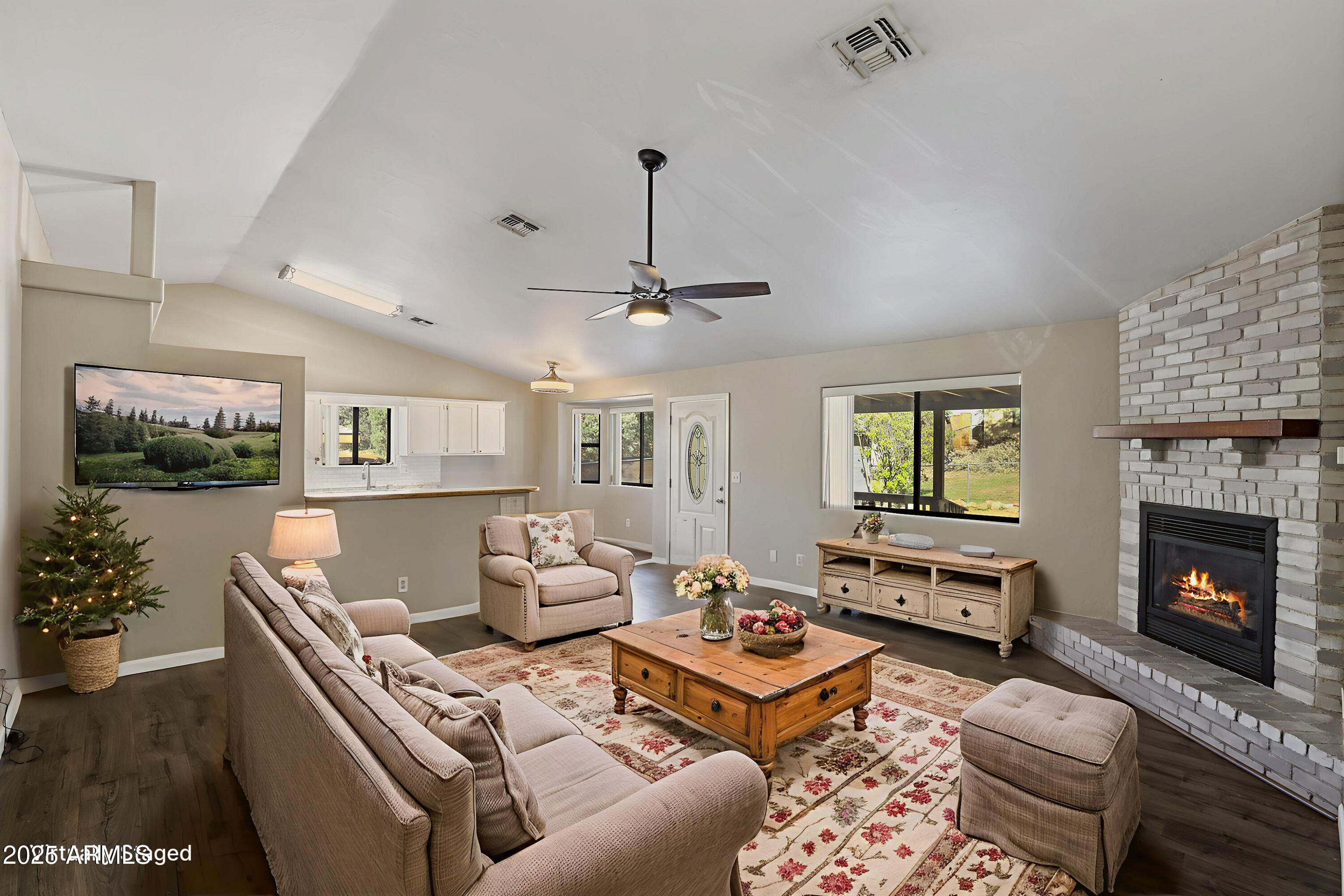 700 West Longhorn Road Payson, AZ 85541 - Photo 2 of 29 a living room with furniture and a fireplace