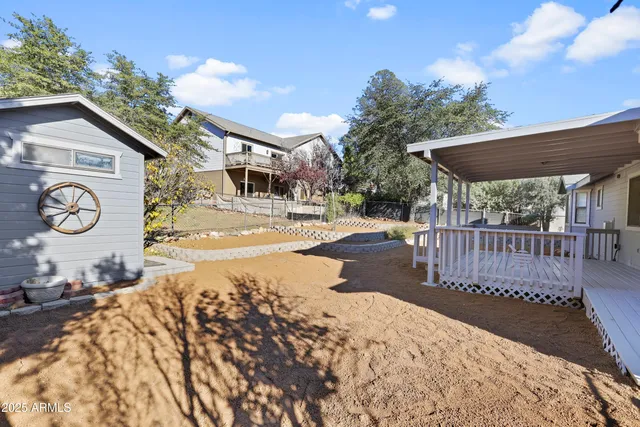 a view of a backyard with a patio
