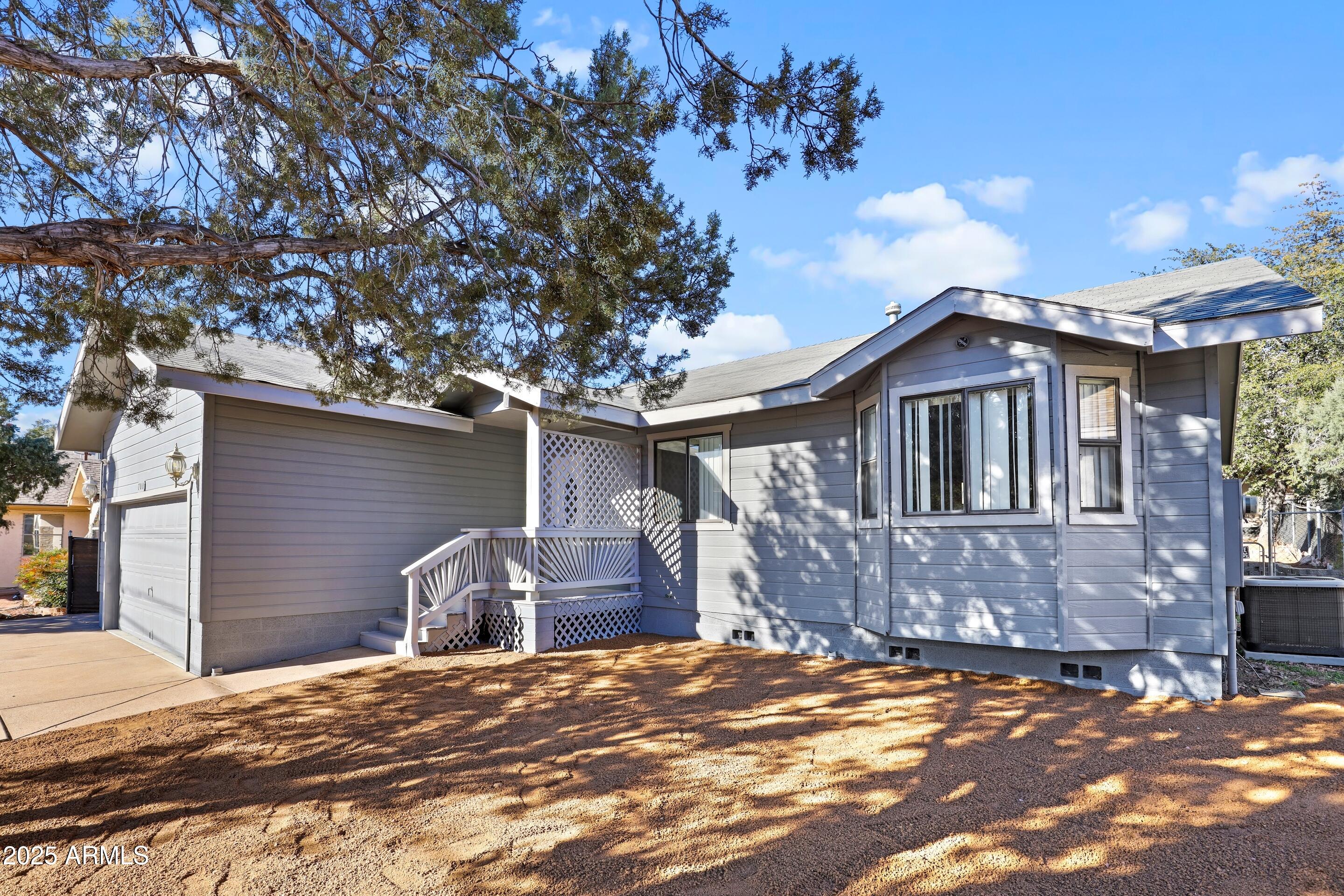 700 West Longhorn Road Payson, AZ 85541 - Photo 29 of 29 a front view of a house with a yard and garage