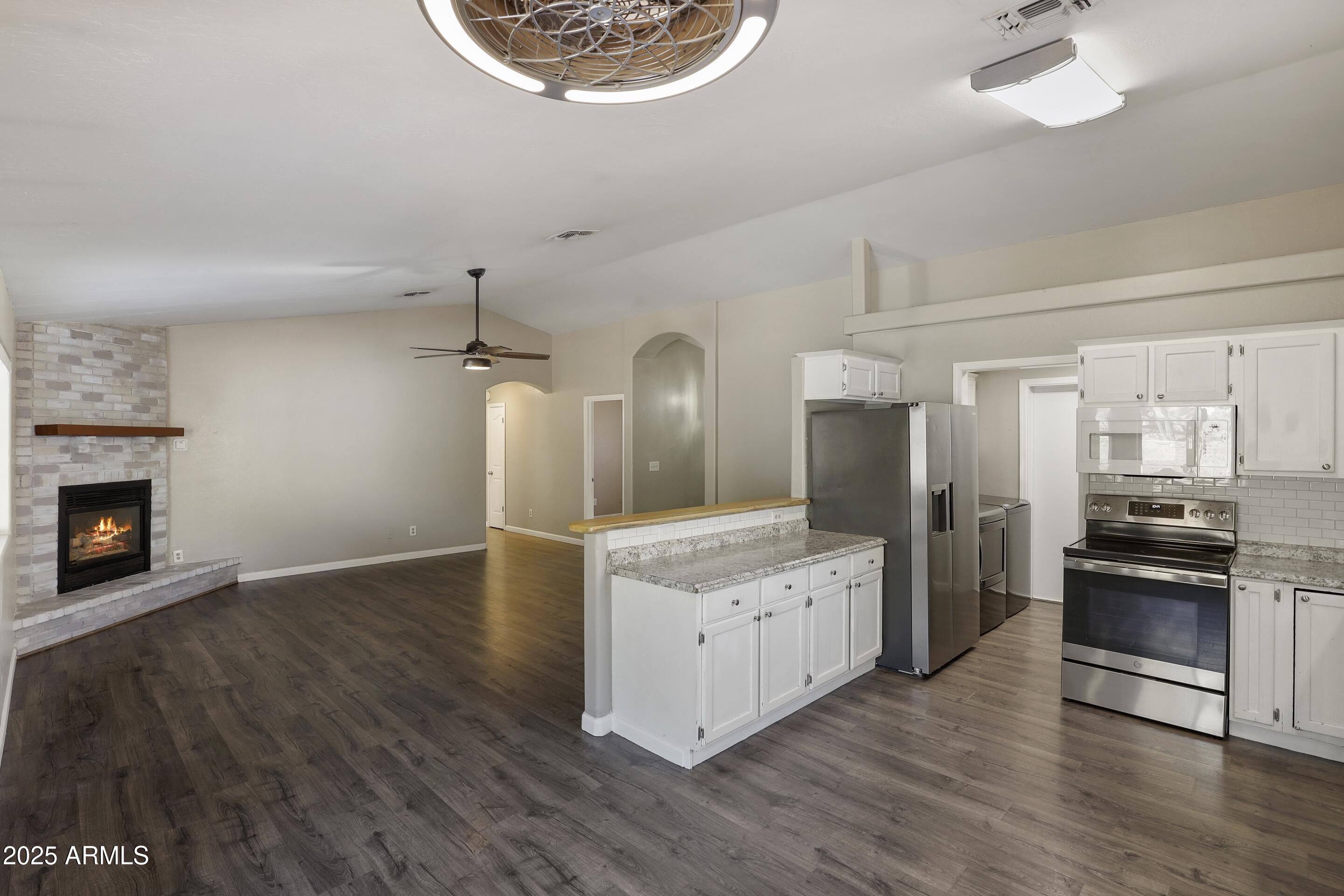 700 West Longhorn Road Payson, AZ 85541 - Photo 6 of 29 a large kitchen with stainless steel appliances granite countertop a stove and a refrigerator