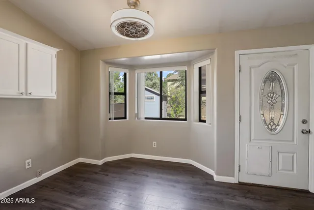 an empty space with wooden floor