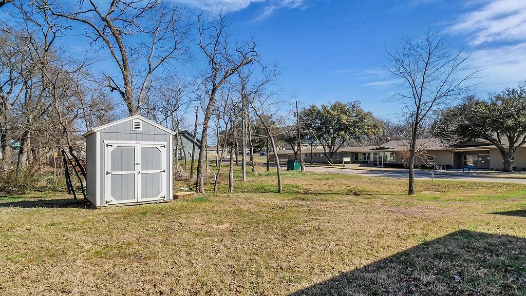 727 East Gandy Street Denison, TX 75021 - Photo 14 of 21 a view of a house with a yard