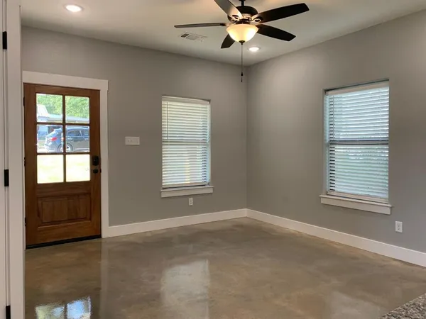 a view of an empty room with a window
