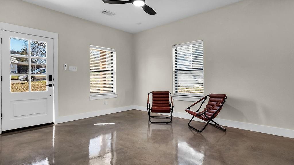 727 East Gandy Street Denison, TX 75021 - Photo 6 of 21 a view of a livingroom with furniture and windows