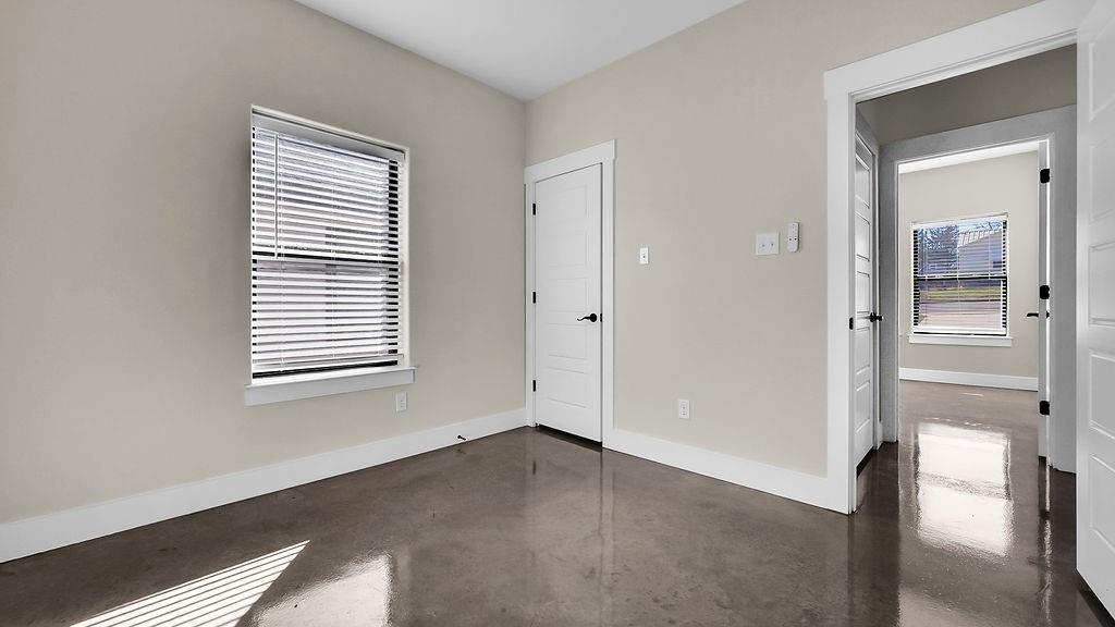 727 East Gandy Street Denison, TX 75021 - Photo 9 of 21 a view of an empty room with a window