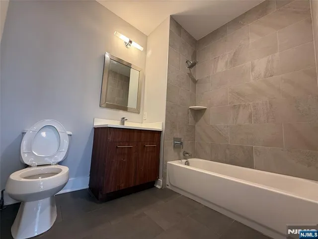 a bathroom with a toilet sink and bathtub