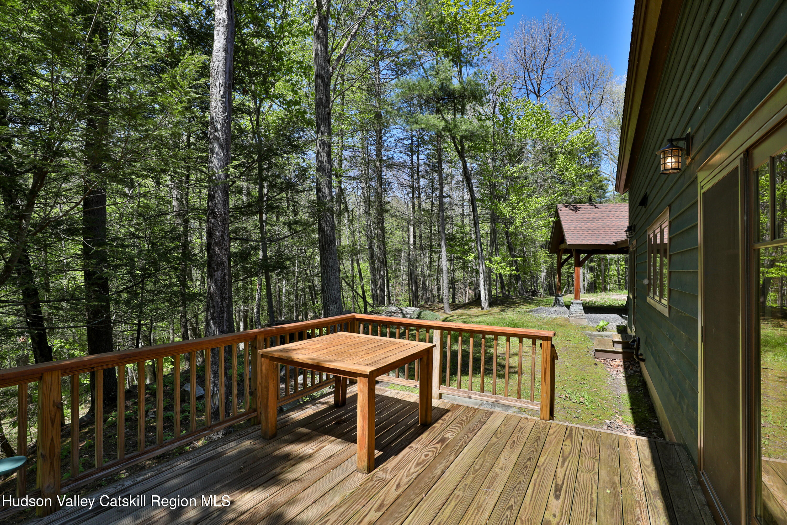 29 Fichtner Road Phoenicia, NY 12464 - Photo 16 of 64 a balcony with wooden floor table and chairs