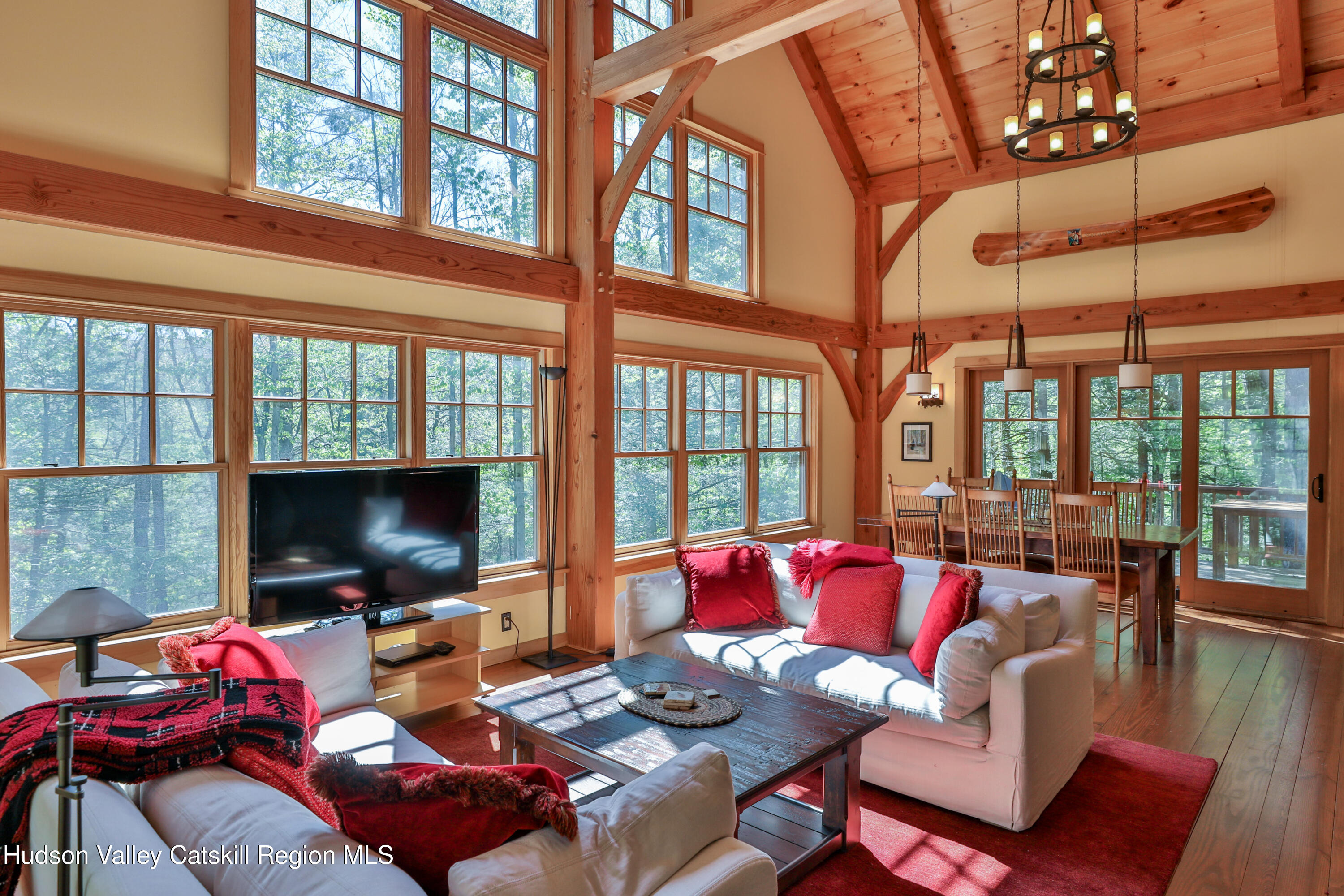 29 Fichtner Road Phoenicia, NY 12464 - Photo 32 of 64 a living room with furniture flat screen tv and a large window