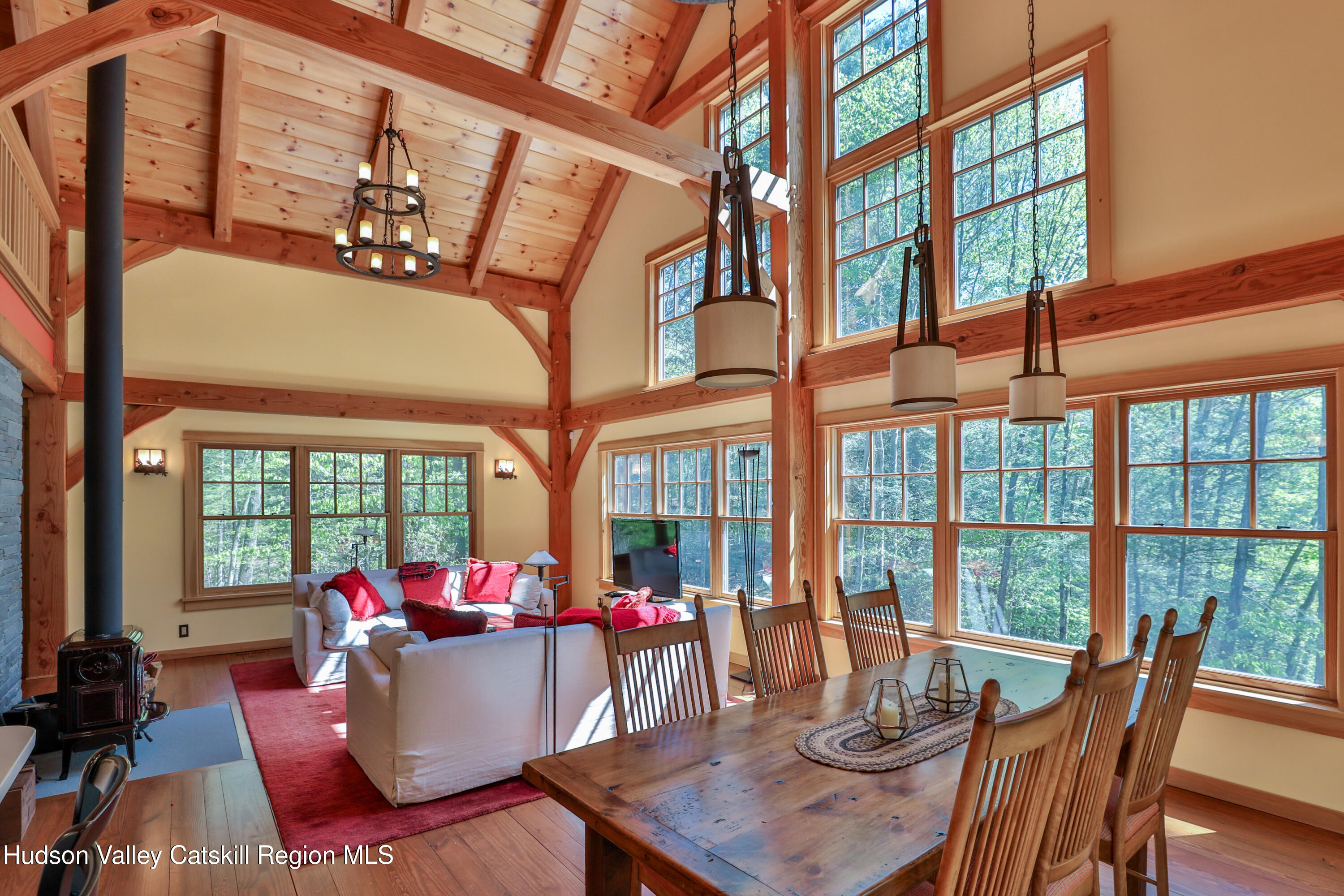 29 Fichtner Road Phoenicia, NY 12464 - Photo 35 of 64 a view of a dining room with furniture large windows and wooden floor