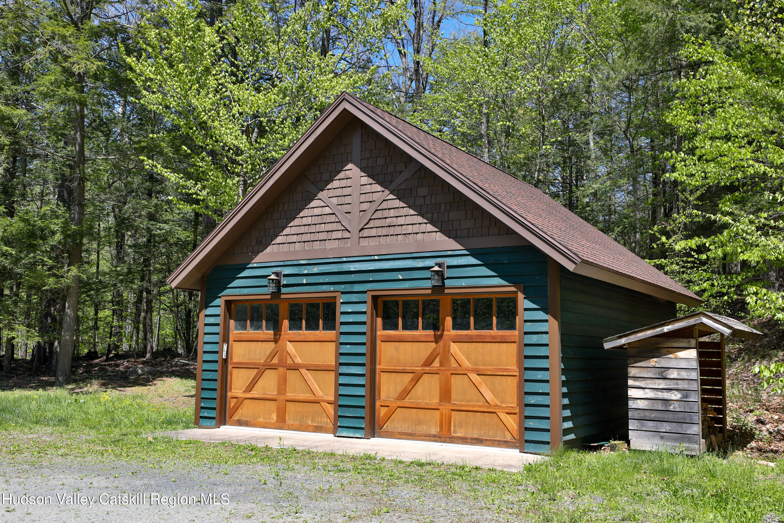 29 Fichtner Road Phoenicia, NY 12464 - Photo 6 of 64 a view of wooden house with a small yard plants and large trees