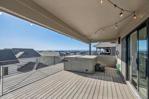 a view of a balcony with wooden floor