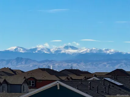 an aerial view of houses with a yard
