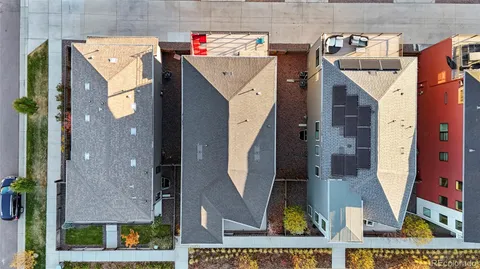 an aerial view of houses with an outdoor space