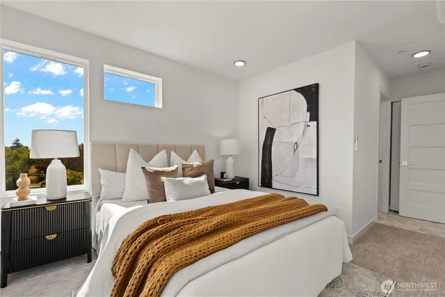 a bedroom with a bed and a lamp