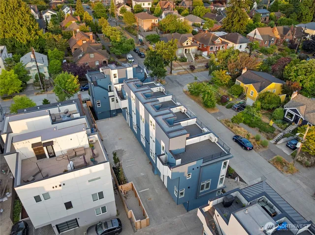 an aerial view of a house with a yard basket ball court and outdoor seating