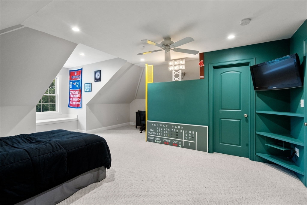 97 Great Plain Avenue Needham, MA 02492 - Photo 29 of 40 a bedroom with a bed and a large window