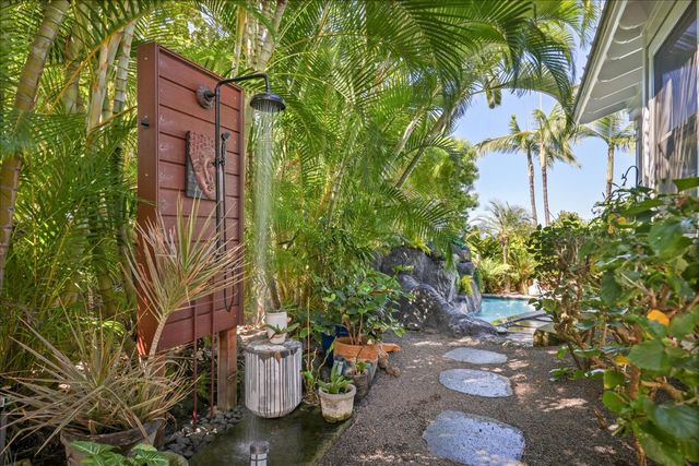 a view of a backyard with sitting area