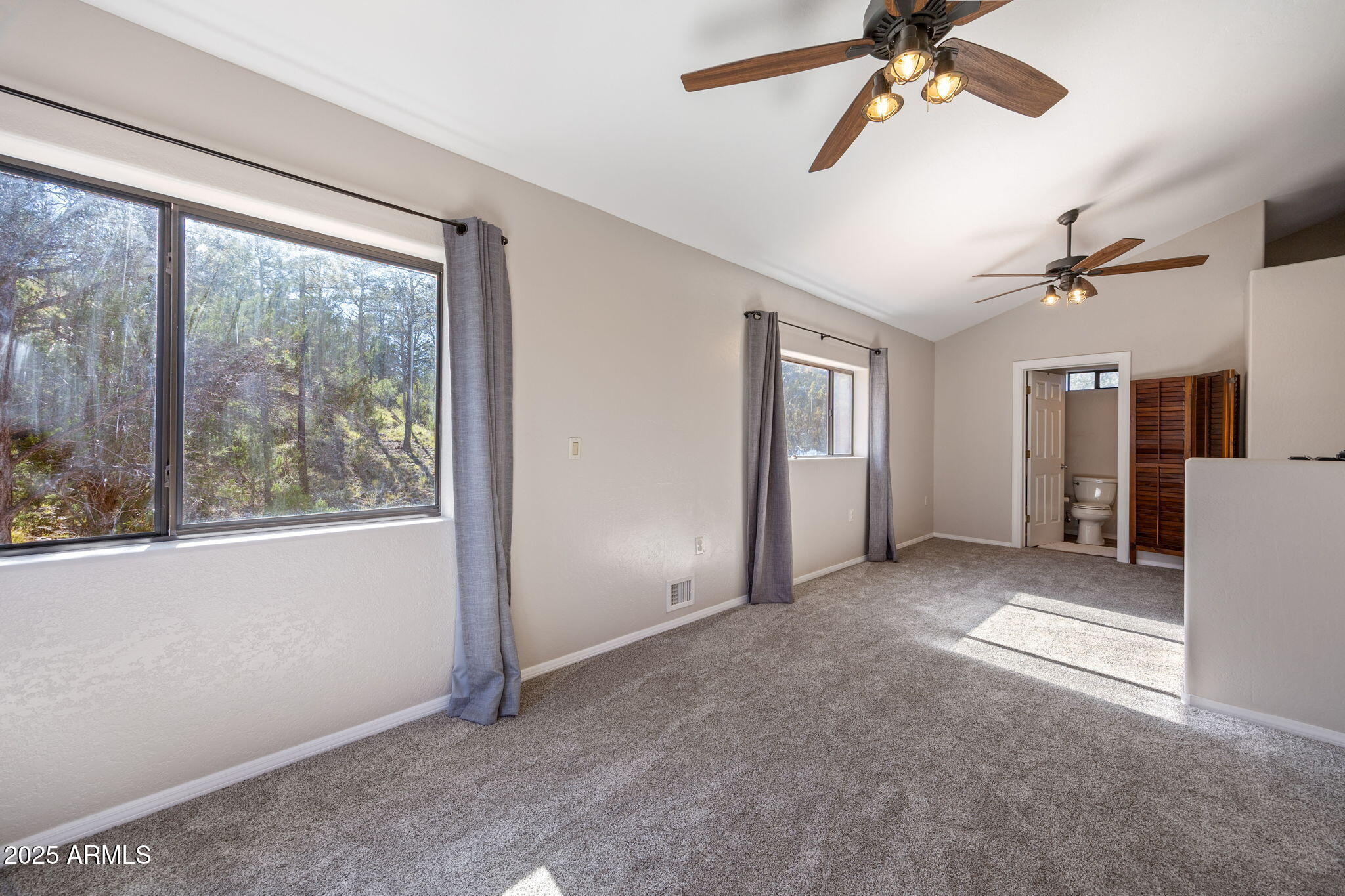 3684 Diamondback Drive Overgaard, AZ 85933 - Photo 14 of 36 an empty room with windows and entrance
