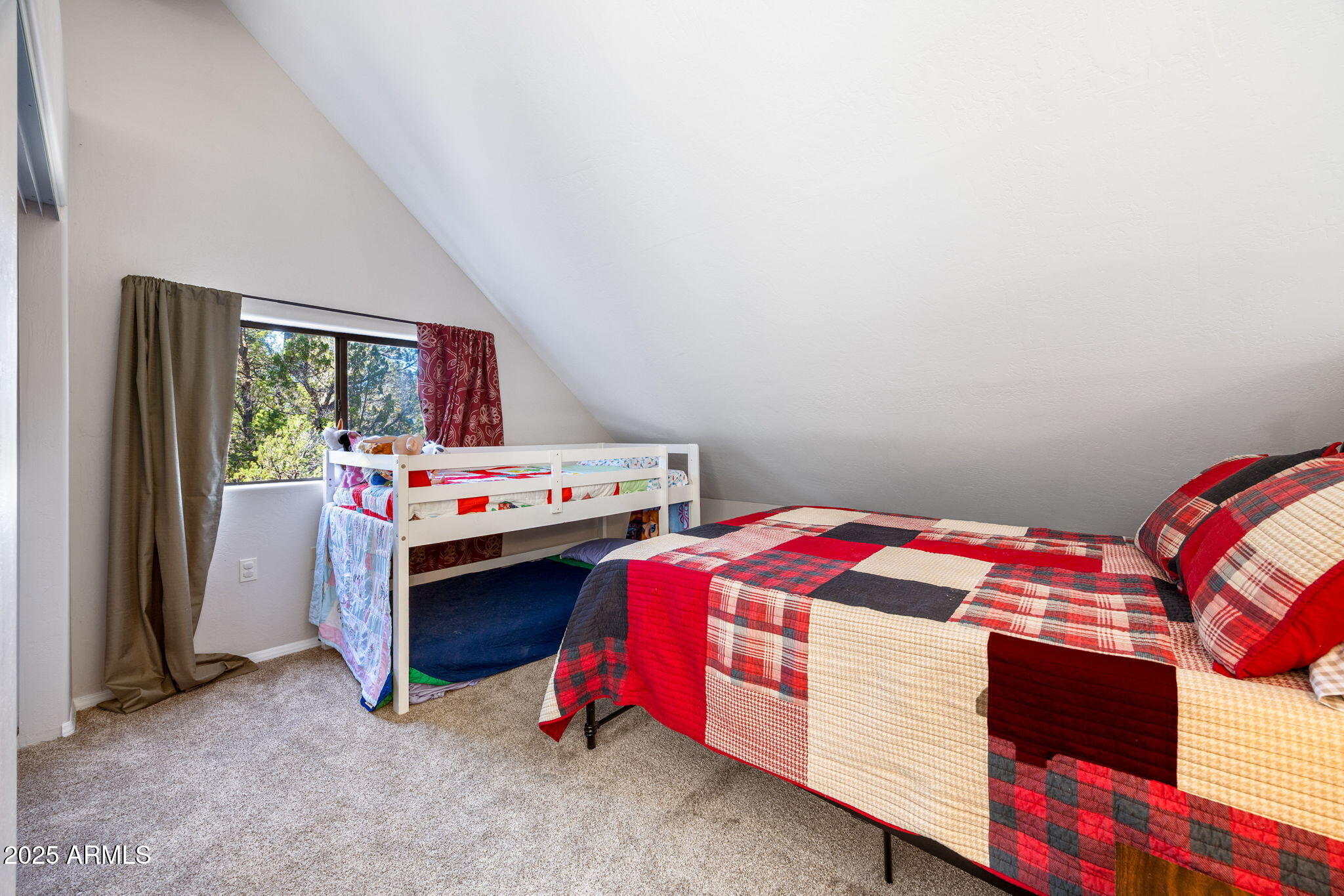 3684 Diamondback Drive Overgaard, AZ 85933 - Photo 16 of 36 a bedroom with a bed and dresser