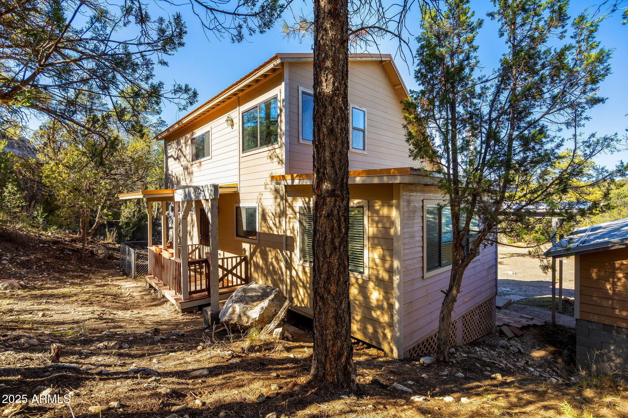 3684 Diamondback Drive Overgaard, AZ 85933 - Photo 22 of 36 a view of a house with a tree