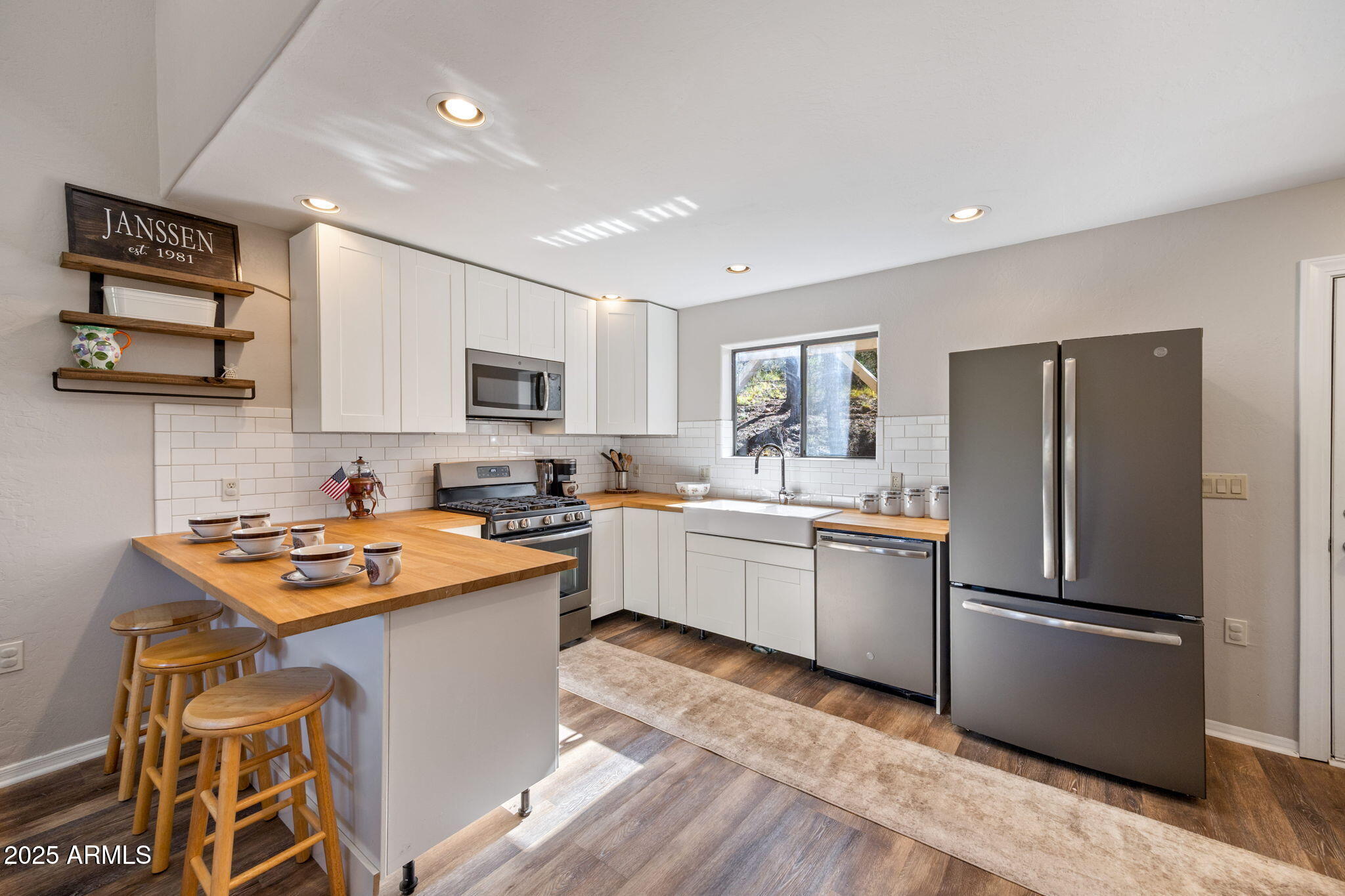 3684 Diamondback Drive Overgaard, AZ 85933 - Photo 7 of 36 a kitchen with a refrigerator a microwave a sink and a stove