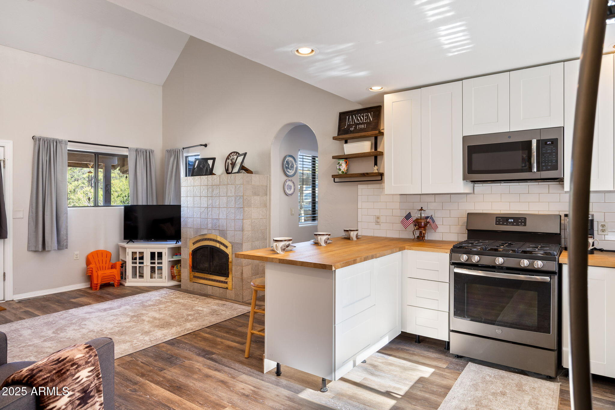 3684 Diamondback Drive Overgaard, AZ 85933 - Photo 8 of 36 a kitchen with a stove a sink and a microwave