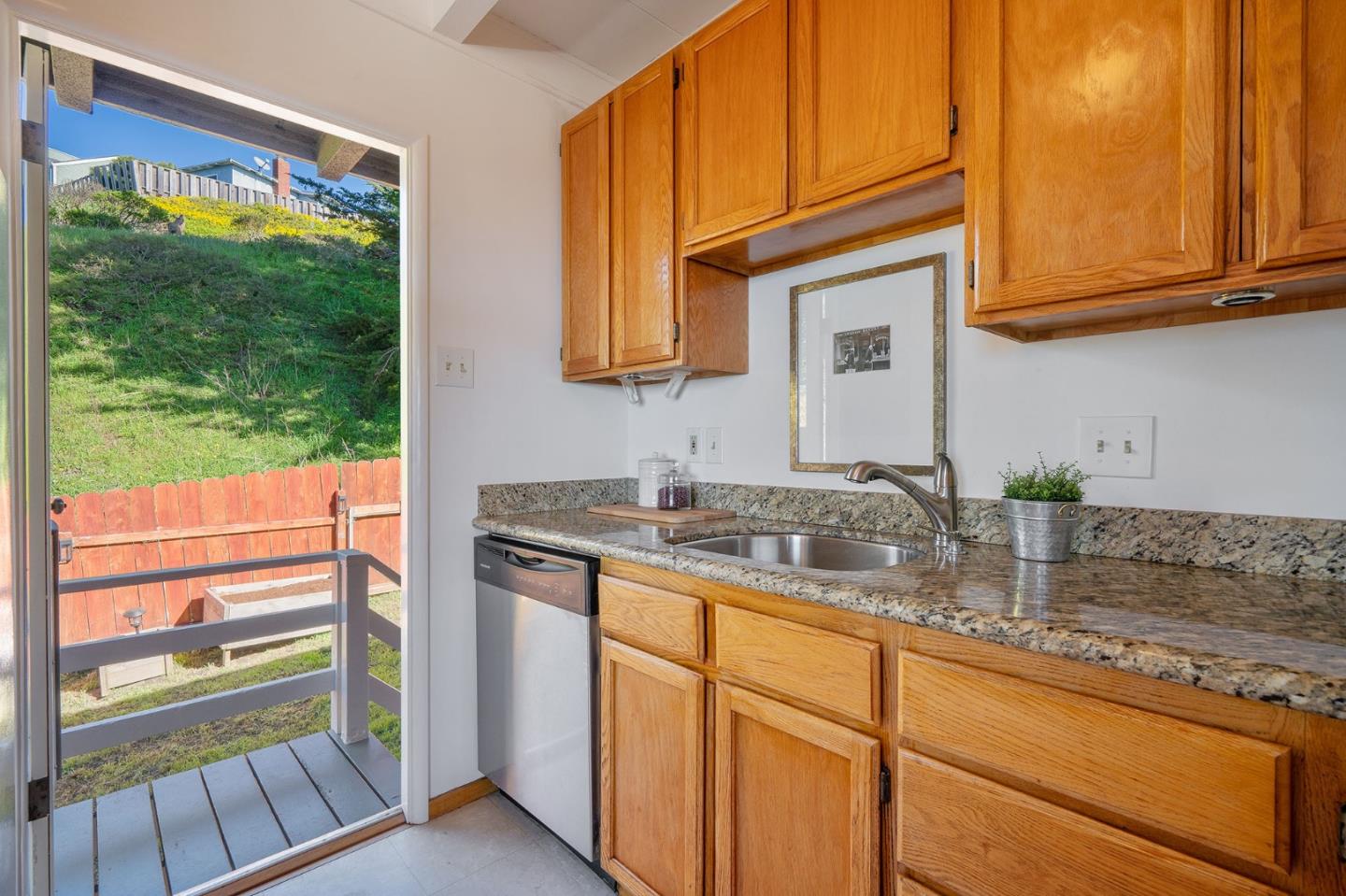559 Manor Drive Pacifica, CA 94044 - Photo 14 of 38 a kitchen with sink and cabinets