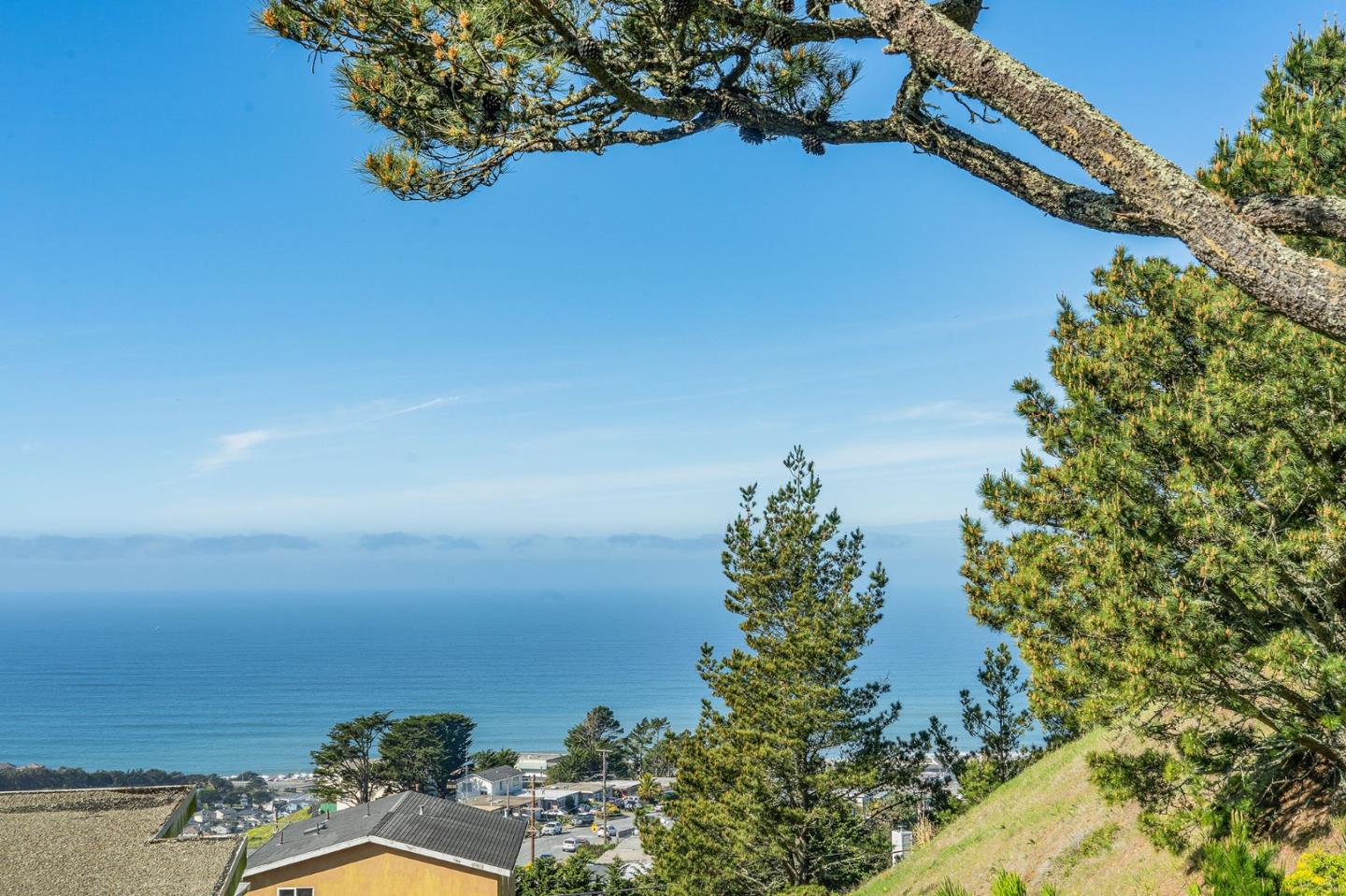 559 Manor Drive Pacifica, CA 94044 - Photo 19 of 38 a view of a lake with a house