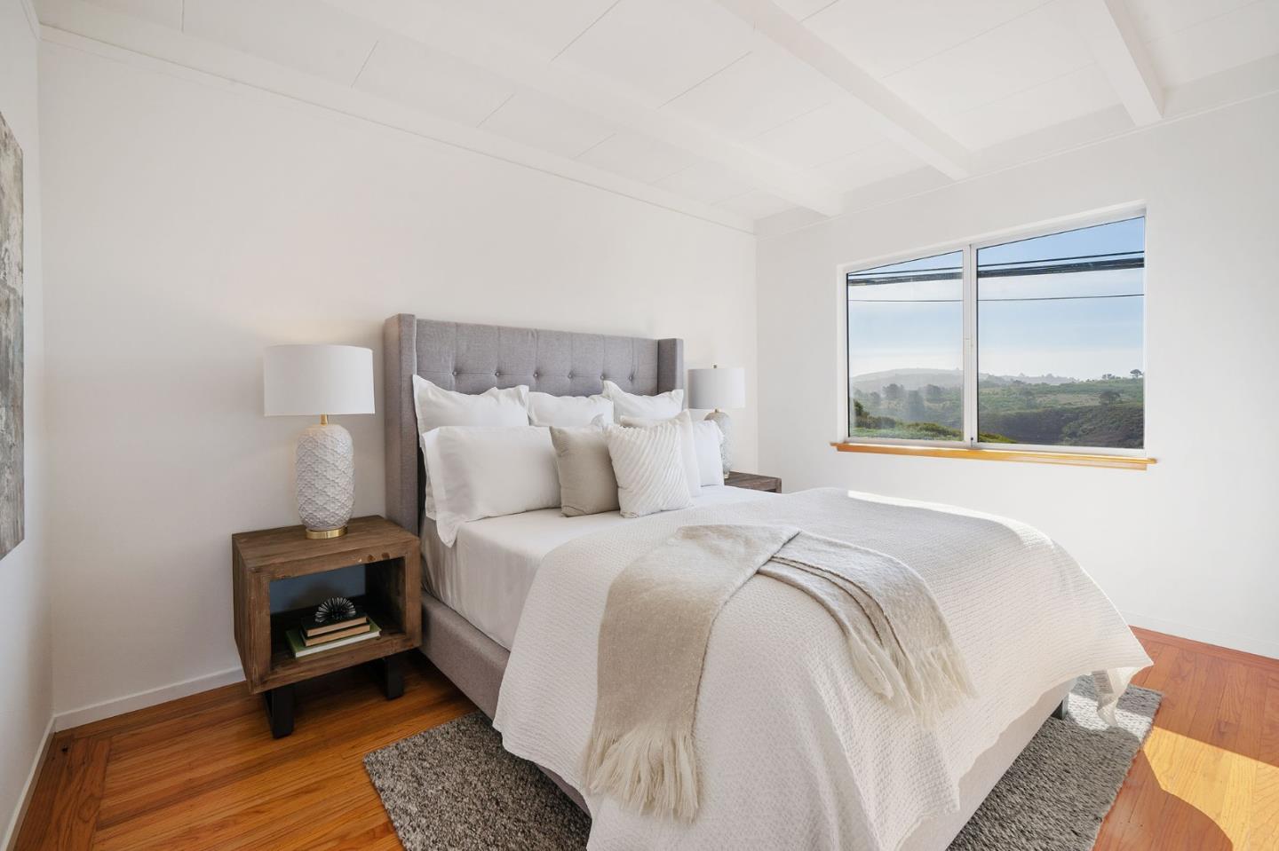 559 Manor Drive Pacifica, CA 94044 - Photo 21 of 38 a bedroom with a bed and a window