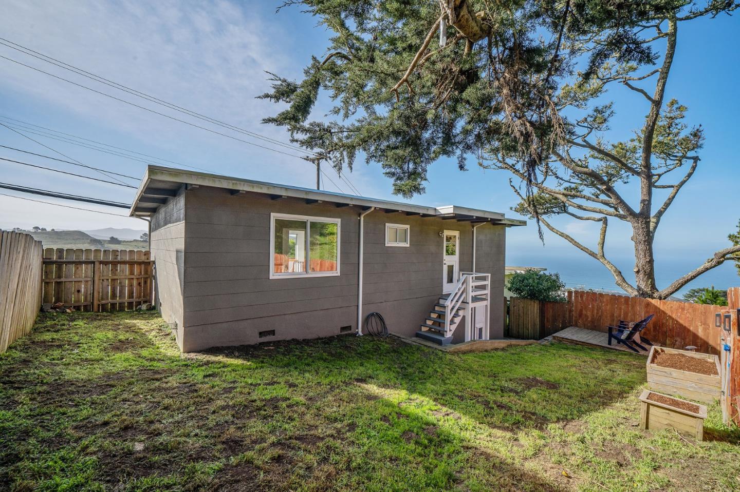 559 Manor Drive Pacifica, CA 94044 - Photo 33 of 38 a view of a backyard with a garden