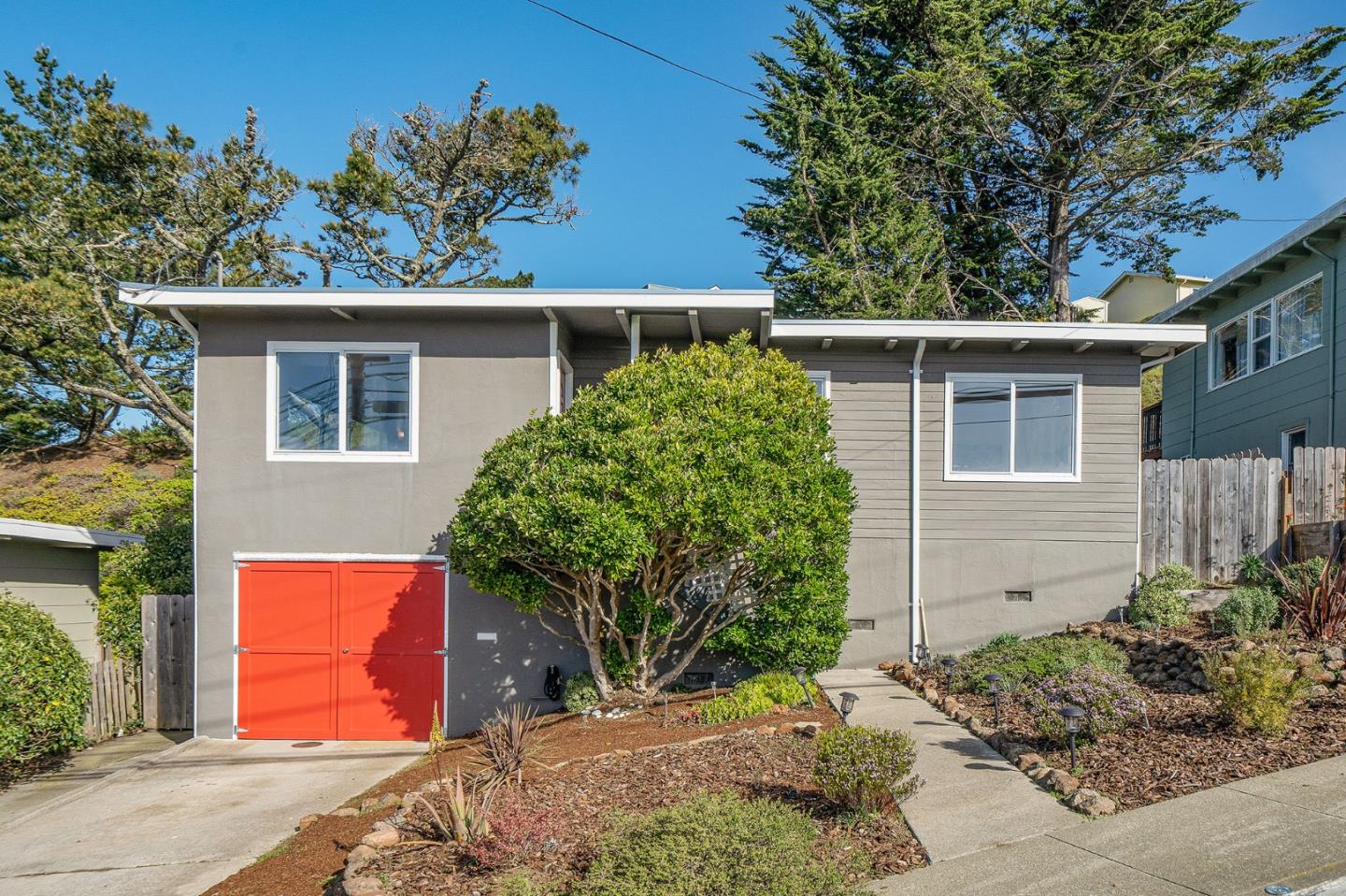 559 Manor Drive Pacifica, CA 94044 - Photo 4 of 38 front view of a house with a yard