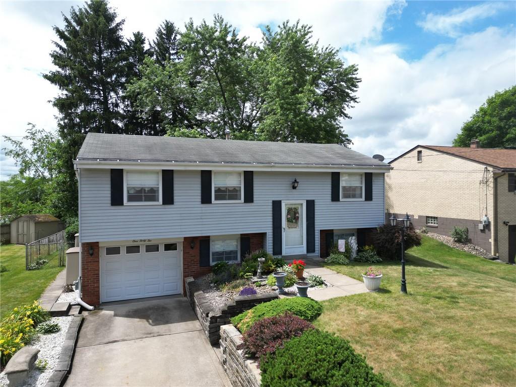 142 William Circle McKees Rocks, PA 15136 - Photo 1 of 23 a front view of a house with a yard table and chairs