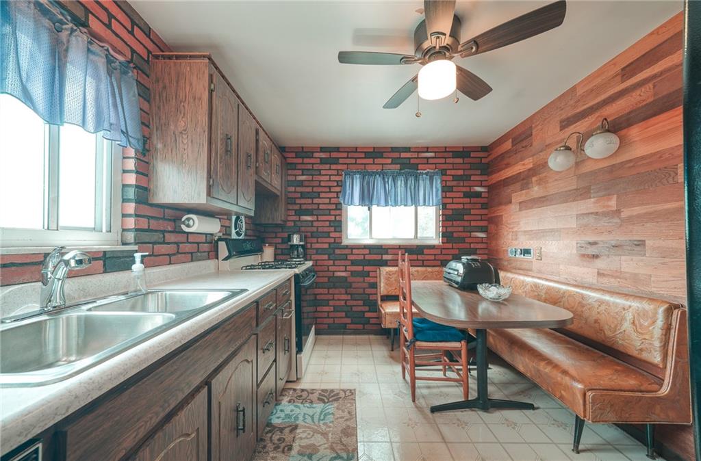 142 William Circle McKees Rocks, PA 15136 - Photo 5 of 23 a kitchen with a sink cabinets and window