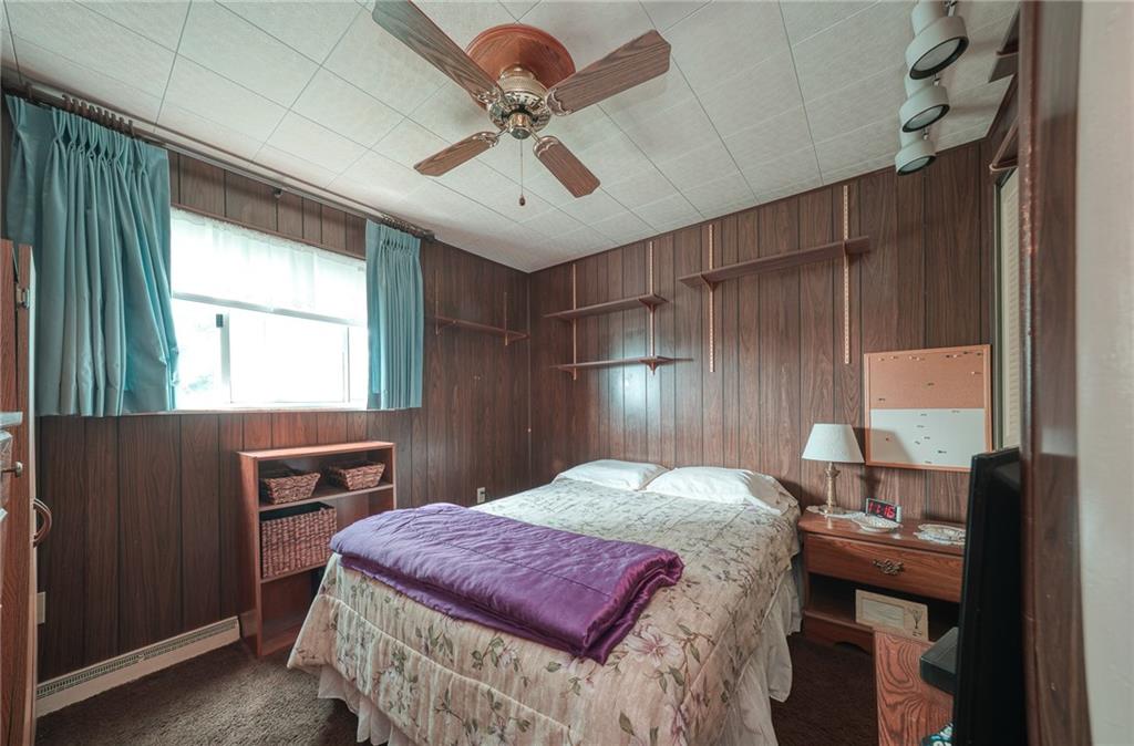 142 William Circle McKees Rocks, PA 15136 - Photo 8 of 23 a bedroom with a bed and a dresser with wooden floor