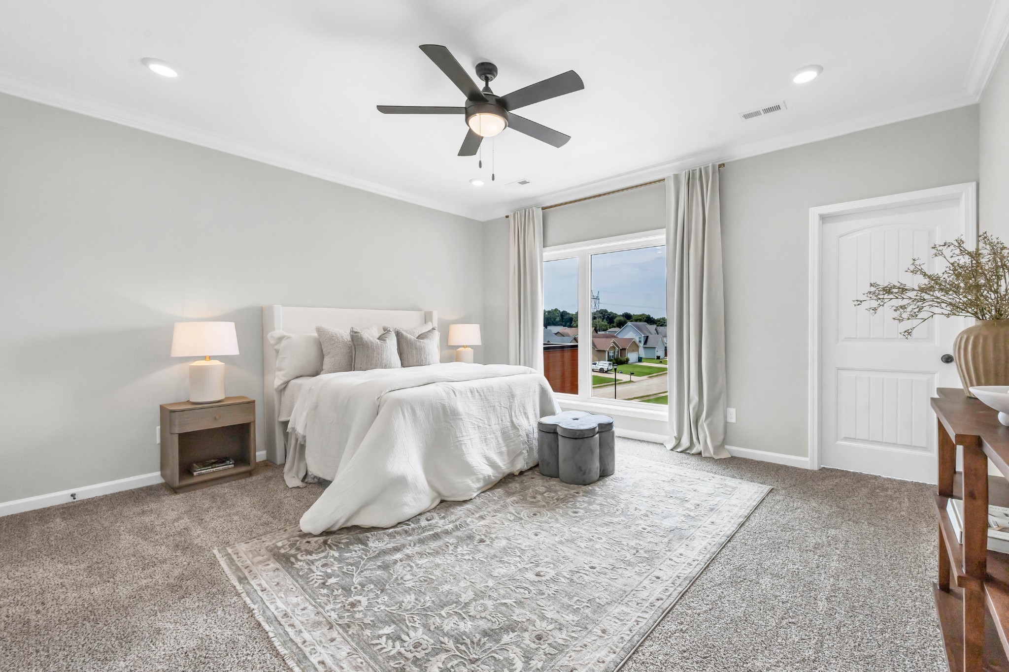 2365 Pea Ridge Road Clarksville, TN 37040 - Photo 23 of 28 a bedroom with a large bed and a chandelier