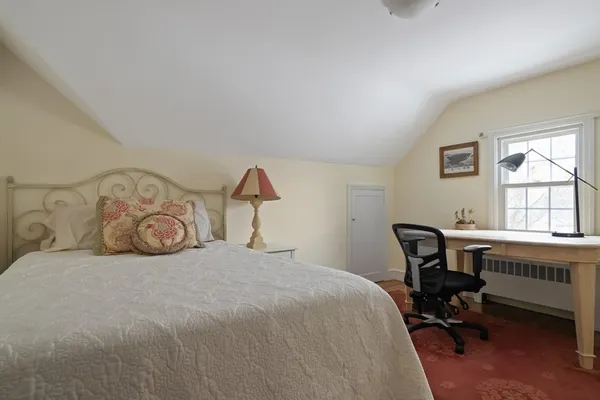 a bathroom with a toilet a sink and a window