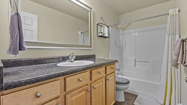 a view of washer and dryer with kitchen in the background