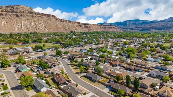 an aerial view of residential houses with outdoor space