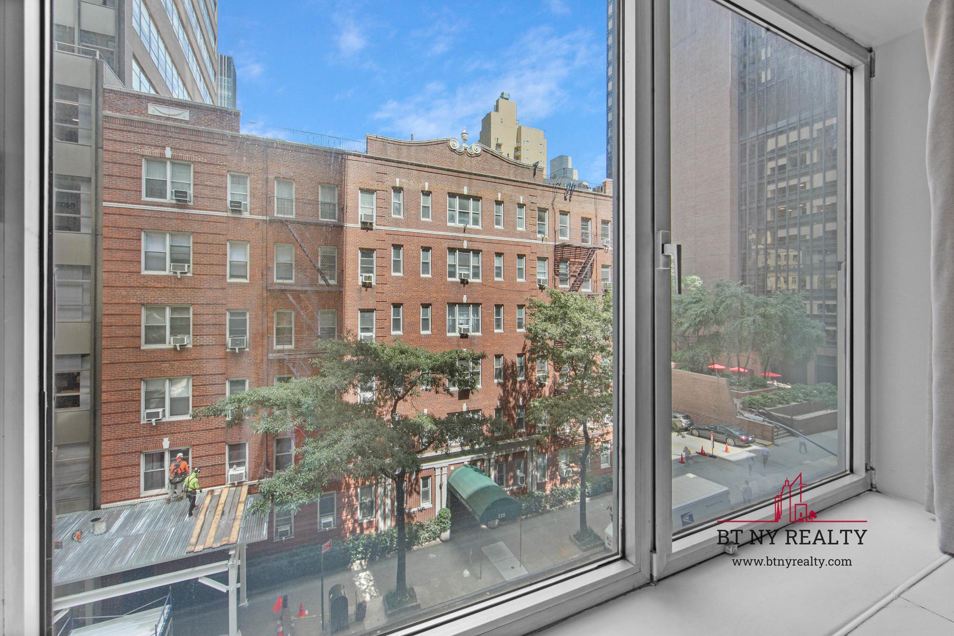 216-218 East 47th Street, Unit 4A Manhattan, NY 10017 - Photo 2 of 10 a view of a building from a window
