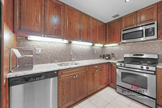 a view of a storage & utility room with washer and dryer