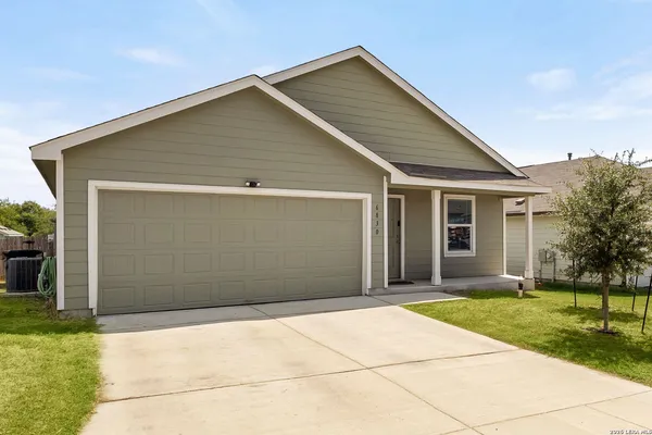 a front view of house with garage