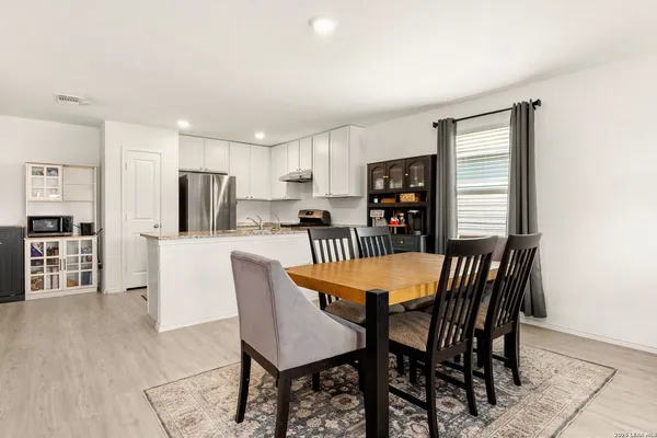 a kitchen with a sink and appliances