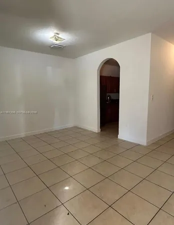 a view of an empty room and window