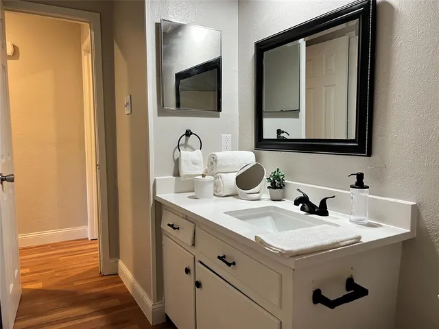 a bathroom with a sink and a mirror