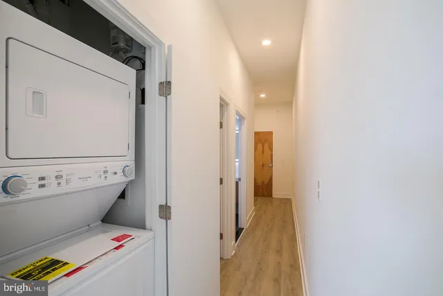 a bathroom with a sink mirror toilet and shower