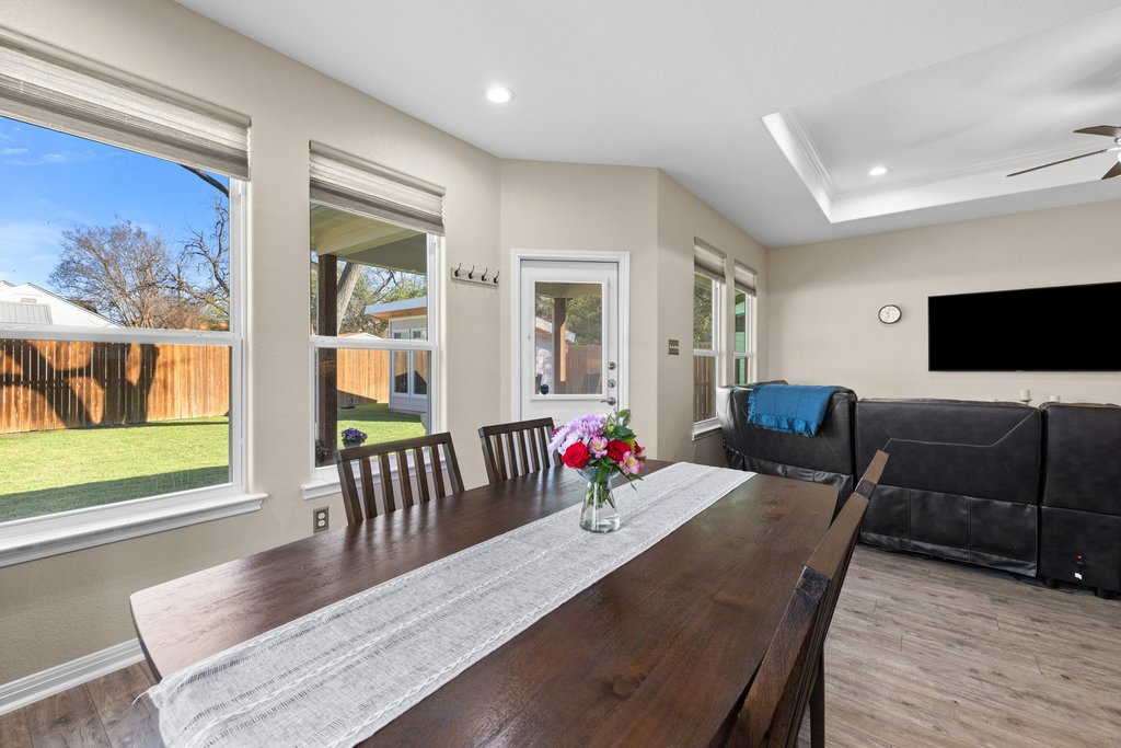 1720 Prather Street Taylor, TX 76574 - Photo 15 of 34 a view of a dining room with furniture window and wooden floor