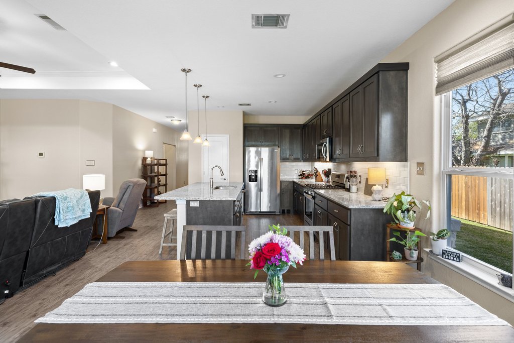 1720 Prather Street Taylor, TX 76574 - Photo 16 of 34 a kitchen view with living room stove and refrigerator