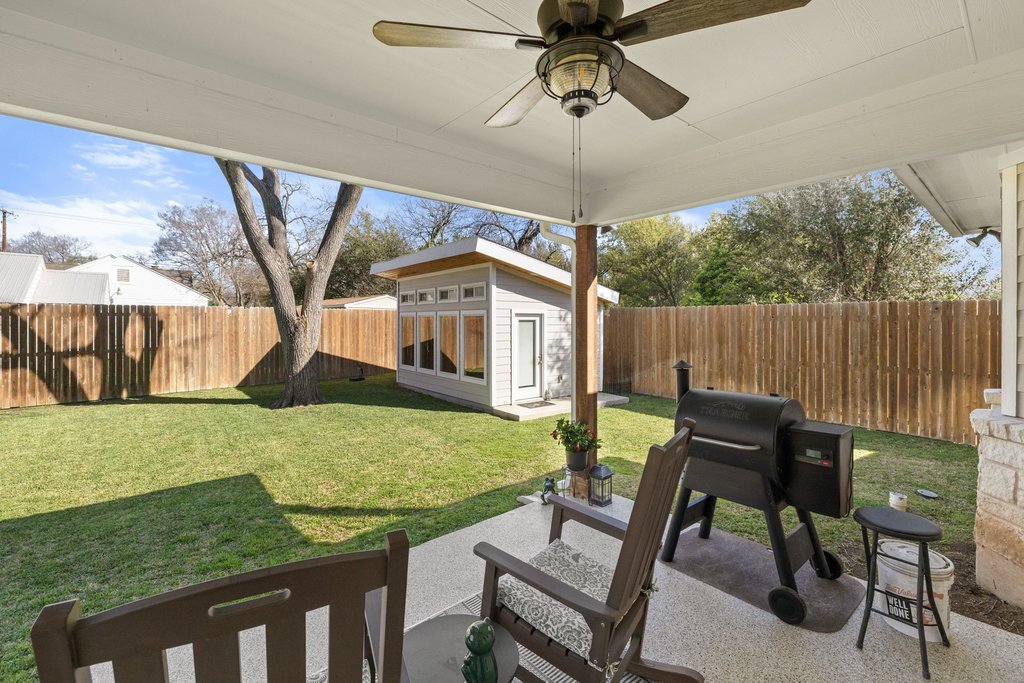 1720 Prather Street Taylor, TX 76574 - Photo 27 of 34 a view of a patio with a table chairs and a table