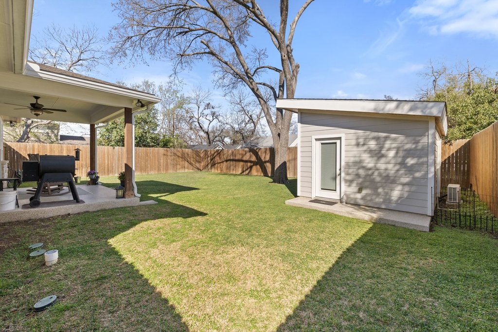 1720 Prather Street Taylor, TX 76574 - Photo 29 of 34 a view of a house with backyard and sitting area